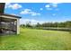 Expansive backyard with views of the pond, offering a serene and private setting at 18185 Cortes Creek Blvd, Spring Hill, FL 34610