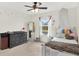Charming bedroom featuring a canopy bed, ceiling fan and a view of the backyard at 18185 Cortes Creek Blvd, Spring Hill, FL 34610