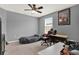 Bedroom with carpeted floors, natural lighting, and a ceiling fan at 18185 Cortes Creek Blvd, Spring Hill, FL 34610
