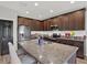 Updated kitchen featuring granite countertops, stainless appliances, and center island at 18185 Cortes Creek Blvd, Spring Hill, FL 34610