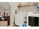 Bright laundry room with modern washer and dryer and plenty of storage space at 18185 Cortes Creek Blvd, Spring Hill, FL 34610