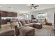 Spacious living room showcasing an open layout, eat-in kitchen, and natural light at 18185 Cortes Creek Blvd, Spring Hill, FL 34610