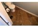 Bathroom with toilet and tile floor in renovated home at 18724 Geraci Rd, Lutz, FL 33548