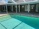 Inviting pool with a beautiful paver patio, perfect for outdoor entertaining and relaxation at 18724 Geraci Rd, Lutz, FL 33548