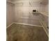 Walk-in closet with wire shelving and carpeted floor in updated home at 18724 Geraci Rd, Lutz, FL 33548