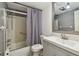 Bathroom with a shower-tub combo, black and white checkered shower curtain, and light gray vanity at 1900 59Th N Ave # 108, St Petersburg, FL 33714
