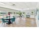 Bright community room with a dining table, desk and abundant natural light at 1900 59Th N Ave # 108, St Petersburg, FL 33714