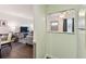 View from hallway looking into the living room featuring comfortable seating and modern decor at 1900 59Th N Ave # 108, St Petersburg, FL 33714