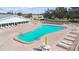 Sparkling community pool with ample lounge chairs, great for relaxation and recreation at 1900 59Th N Ave # 108, St Petersburg, FL 33714