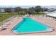 Community swimming pool with brick pavers, lounge chairs, and well-maintained landscaping at 1900 59Th N Ave # 108, St Petersburg, FL 33714