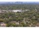 This aerial view captures a neighborhood near downtown, surrounded by trees and suburban amenities at 1906 E Idlewild Ave, Tampa, FL 33610