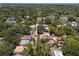 A nice aerial view of the neighborhood, showcasing the home's location among lush greenery at 1906 E Idlewild Ave, Tampa, FL 33610