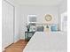 Bright bedroom featuring a golden bedframe, natural light and a closet at 1906 E Idlewild Ave, Tampa, FL 33610