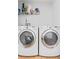 Functional laundry room features a side-by-side washer and dryer at 1906 E Idlewild Ave, Tampa, FL 33610