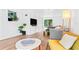 Open living space with luxury vinyl floors and comfortable seating leading to the patio doors at 1906 E Idlewild Ave, Tampa, FL 33610