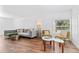 Welcoming living room featuring luxury vinyl floors and a modern, comfortable seating arrangement at 1906 E Idlewild Ave, Tampa, FL 33610