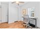 Bright home office featuring hardwood floors, a closet, and natural light at 1906 E Idlewild Ave, Tampa, FL 33610