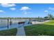 Scenic dock on the water, featuring benches and tables, perfect for enjoying waterfront views at 19701 Gulf Blvd # 210, Indian Shores, FL 33785
