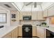 Bright kitchen featuring updated appliances, light wood cabinetry, and ample countertop space at 19701 Gulf Blvd # 210, Indian Shores, FL 33785