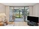 View of the inviting lanai with comfortable seating, providing a seamless transition to outdoor living at 19701 Gulf Blvd # 210, Indian Shores, FL 33785