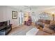 Cozy living room with plush sofa, recliner, and view into other rooms at 19701 Gulf Blvd # 210, Indian Shores, FL 33785