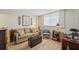 Cozy living room with plush seating, bright window, and stylish decor at 19701 Gulf Blvd # 210, Indian Shores, FL 33785