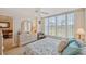 Inviting bedroom with a cozy bed, lots of natural light, and a scenic view at 19701 Gulf Blvd # 210, Indian Shores, FL 33785