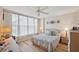 Bright bedroom with lots of natural light, a ceiling fan, and stylish decor at 19701 Gulf Blvd # 210, Indian Shores, FL 33785