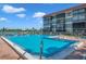 Large community pool with chairs for lounging and relaxing, with easy access to condos at 19701 Gulf Blvd # 210, Indian Shores, FL 33785