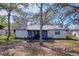 Backyard featuring the house, and a screened in porch at 2004 Nobleton Ave, Spring Hill, FL 34608