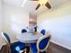 Cozy dining area with blue upholstered chairs and modern fixtures at 2004 Nobleton Ave, Spring Hill, FL 34608