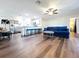 Open-concept living room and kitchen featuring stainless steel appliances and modern finishes at 2004 Nobleton Ave, Spring Hill, FL 34608