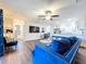 Comfortable living room with an open floor plan, kitchen with bar seating, and a view to a bathroom at 2004 Nobleton Ave, Spring Hill, FL 34608