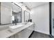 Modern bathroom featuring double vanity, vessel sinks, and sleek black hardware at 2140 Catalina Dr, Clearwater, FL 33764
