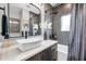 Well-designed bathroom featuring a modern sink, dark-stained cabinets, and a combination shower and tub at 2140 Catalina Dr, Clearwater, FL 33764