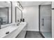 Stylish bathroom featuring double vanity, vessel sinks, modern fixtures, and glass-enclosed shower at 2140 Catalina Dr, Clearwater, FL 33764