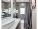Well-designed bathroom featuring a modern sink, dark-stained cabinets, and a combination shower and tub at 2140 Catalina Dr, Clearwater, FL 33764
