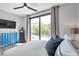 Bright bedroom showcasing a large glass door leading to a balcony with natural light and decor at 2140 Catalina Dr, Clearwater, FL 33764