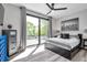 Bedroom featuring a sliding glass door leading to a balcony, and light wood floors at 2140 Catalina Dr, Clearwater, FL 33764