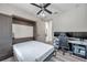 Versatile bedroom with murphy bed, office setup, and modern gray tones at 2140 Catalina Dr, Clearwater, FL 33764