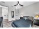 Neutral bedroom featuring dark furniture, light wood floors, and modern accents at 2140 Catalina Dr, Clearwater, FL 33764