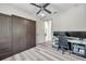 Versatile bedroom with a murphy bed, office setup, and modern gray tones throughout at 2140 Catalina Dr, Clearwater, FL 33764