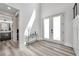 Bright, spacious foyer with modern flooring, high ceilings, and a clear view of the staircase and other rooms at 2140 Catalina Dr, Clearwater, FL 33764