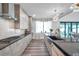 Well-appointed kitchen with modern appliances, granite countertops, and plenty of cabinet space for storage and organization at 2140 Catalina Dr, Clearwater, FL 33764
