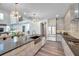 Spacious open-concept kitchen with a large island, stainless steel appliances, and seamless flow to the dining area at 2140 Catalina Dr, Clearwater, FL 33764