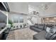 Cozy living room featuring a plush sofa, modern entertainment center, and stylish decor, creating a welcoming atmosphere at 2140 Catalina Dr, Clearwater, FL 33764