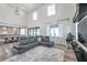 Spacious living room with soaring ceilings, abundant natural light, and a comfortable sectional sofa at 2140 Catalina Dr, Clearwater, FL 33764