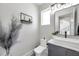 Stylish powder room featuring a modern vanity, decorative accents, and a minimalist design at 2140 Catalina Dr, Clearwater, FL 33764