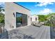 View of the rooftop deck, with its black metal railing and space for outdoor lounge chairs at 2140 Catalina Dr, Clearwater, FL 33764