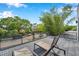 Spacious rooftop deck offers seating and neighborhood views through black metal railings at 2140 Catalina Dr, Clearwater, FL 33764
